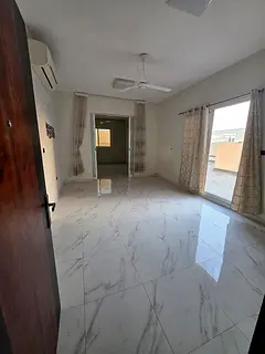 For annual rent in Ajman: Two bedrooms, a living room, and a roof terrace. Excellent spaces. Three