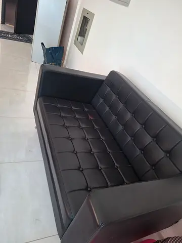 Black tufted leather armchair - good condition