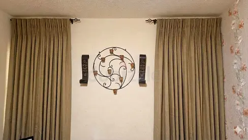 Pair of new beige floor-length blackout curtains