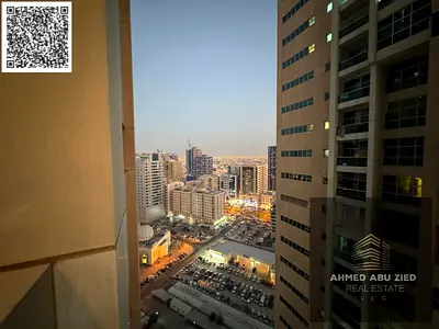 شقة 2 غرف نوم ماستر مفروشة للإيجار في أبراج عجمان وان الراشدية 3 | إطلالة بحرية جزئية مع 2 بلكونة وباركن بـ 48,000 موقع مميز بجوار جميع الخدمات