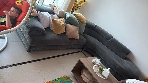 Three-seater grey fabric sofa with cushions - good condition