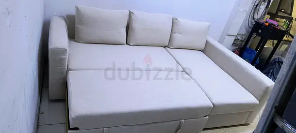 Beige L-shaped Sofa Bed with Storage — Good Condition