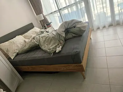 Bed frame with upholstered headboard