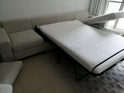 4 seat L-shaped sofa with pull-out bed, good condition