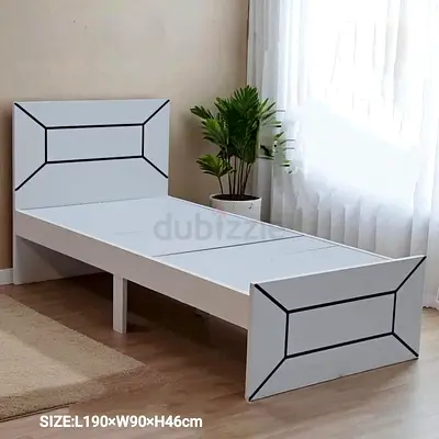 Single white wooden bed frame with geometric headboard and footboard
