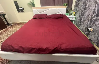 White upholstered double bed frame with padded headboard - good condition