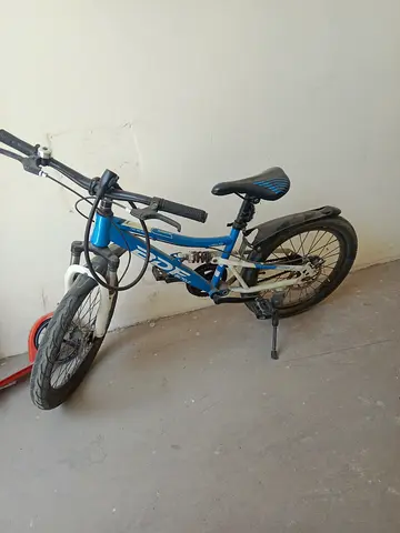 Blue kids mountain bike with suspension — used