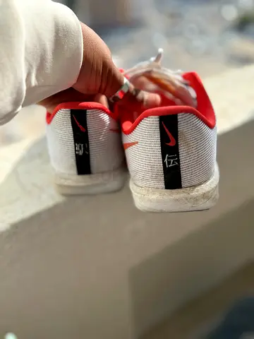 Used Nike Rival Zoom Fly 4 low-top white sneakers with red trim, size available