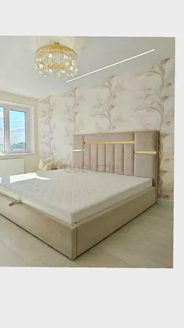 Beige upholstered king-size bed frame with storage and headboard lighting