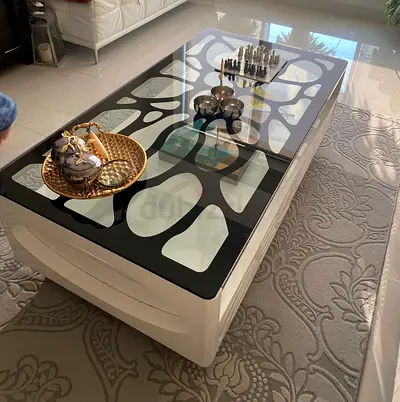 Modern white and black glass-top coffee table