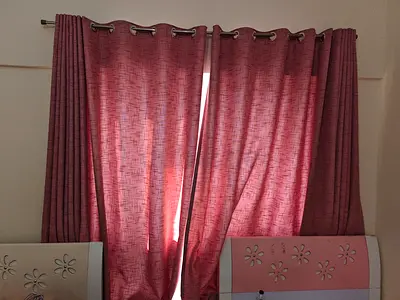 Pair of pink fabric eyelet curtains - good condition