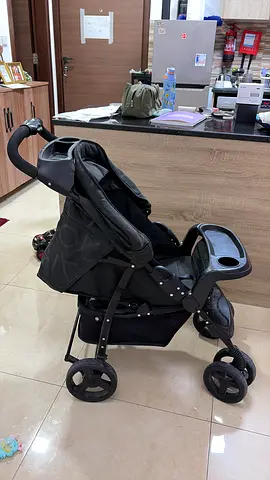 Used black standard baby stroller in good condition
