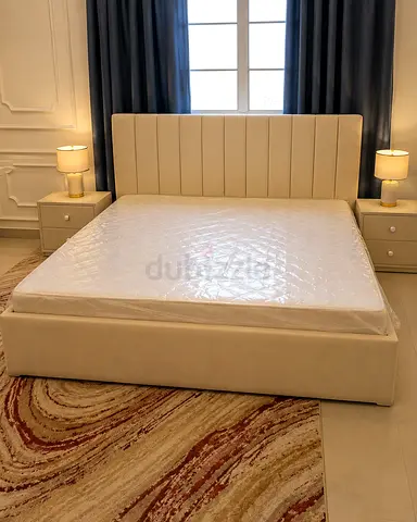 King-size upholstered bed frame with mattress and two bedside tables