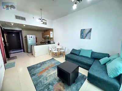 Furnished one-bedroom apartment for monthly rent in City Towers, directly on Khalifa Street in Ajman, in a prime and vibrant location near Safeer Mall