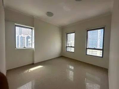 Luxury two-bedroom apartment with a living room in Al Majaz 2, Sharjah, available for annual rent - Balcony with open views - Master bedroom - 3 bathr