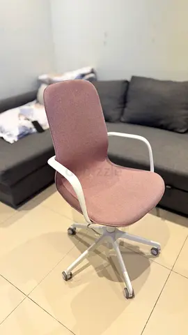 Pink office chair with white frame and armrests