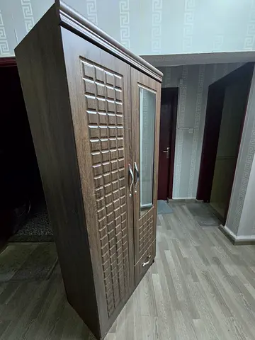 Two-door wooden wardrobe with mirror and drawer - good condition