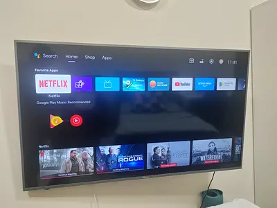 Mounted 58-inch Smart LED TV with Android OS - Good Condition