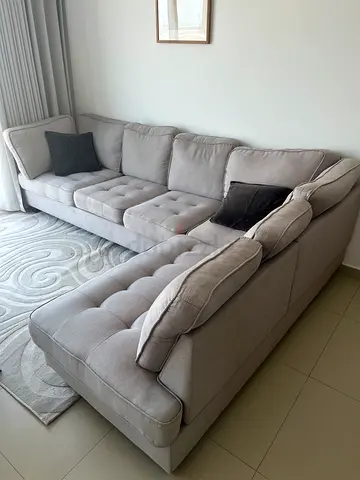 Light grey L-shaped tufted fabric sectional sofa - good condition