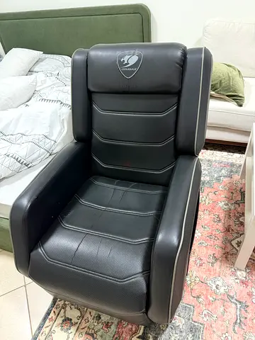 Black Cougar leather reclining chair — excellent condition working perfectly