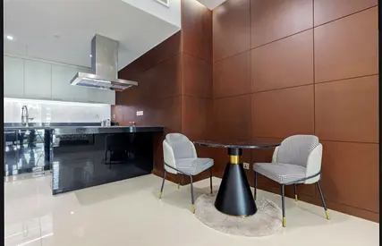 Small round dining table with two upholstered chairs - modern set