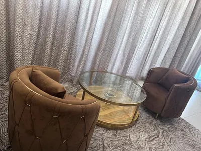Pair of brown velvet armchairs with glass coffee table - excellent condition