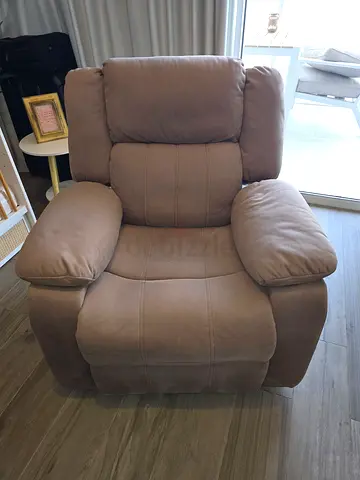 Single beige recliner armchair in good condition