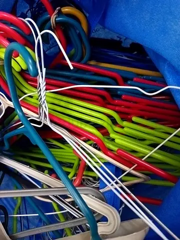 50 plus Bundle of mixed plastic and metal clothes hangers