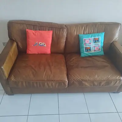 Pure leather sofas 2 seater (2 pieces) and wooden center table for sale
