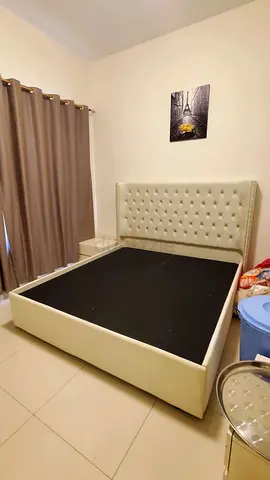 Queen-sized upholstered bed frame with tufted headboard and bedside table (cream)