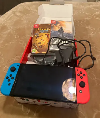 nintendo switch oled 1 with 2 games