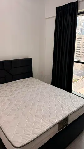 Queen mattress with upholstered bed base and headboard - good condition