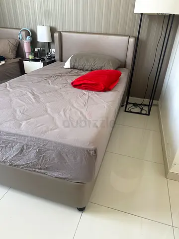 Single leather-look bed with headboard — good condition included with mattress