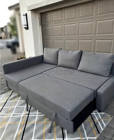 Ikea gray Friheten L-shaped sofa with storage combed