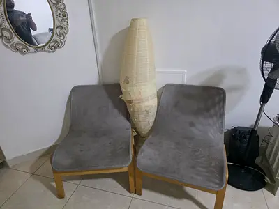 Pair of grey fabric dining chairs with wooden legs - used