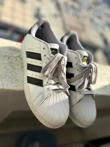 White Adidas Superstar sneakers with black stripes - used, size 12