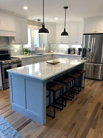 Modern white kitchen island with storage and sitting
