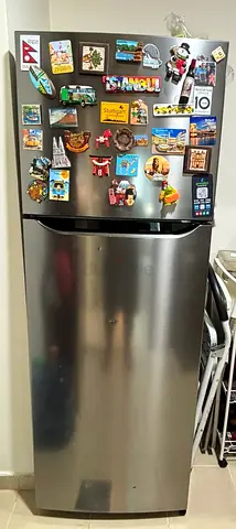 Silver double-door LG refrigerator in good working condition