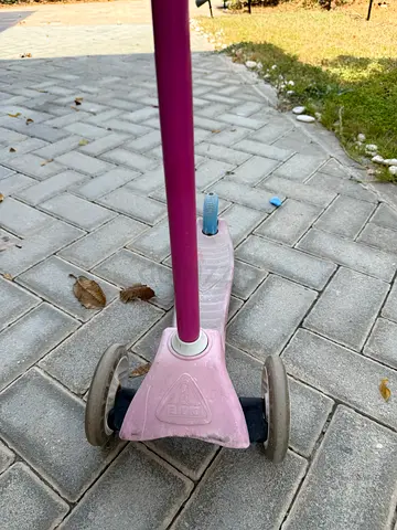 Pink three-wheel kids scooter - Early Learning brand in good used condition with protection helmet