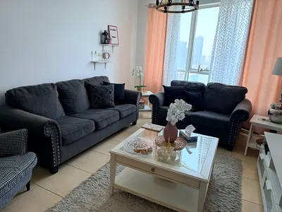 Dark grey 3-seater and two  2-seater sofa set with studded arms.