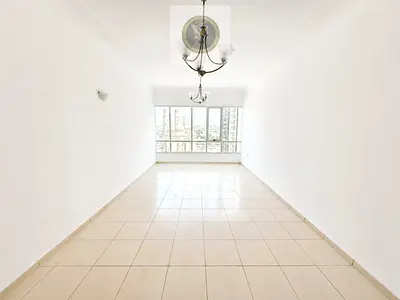 Two Bedrooms And Hall Apartment For Annual Rent Open View And Panoramic Windows Wall Cabinets And Separate Kitchen With Balcony New Al Taawun Street