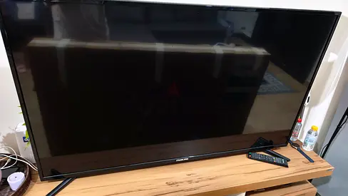55-inch Flat Screen TV in Good Working Condition with Remote