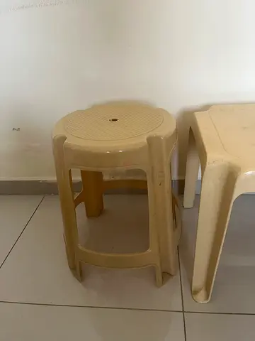 Beige plastic stools  and chair for AED 20