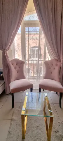 Pair of pink upholstered accent chairs - lightly used