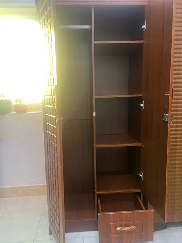 Wooden Wardrobe with Multiple Compartments and Drawers