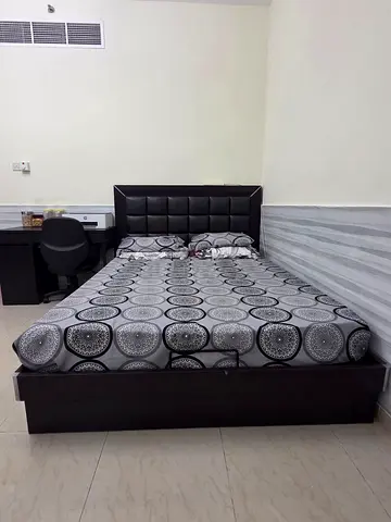 Queen size wooden bed with upholstered headboard - dark brown