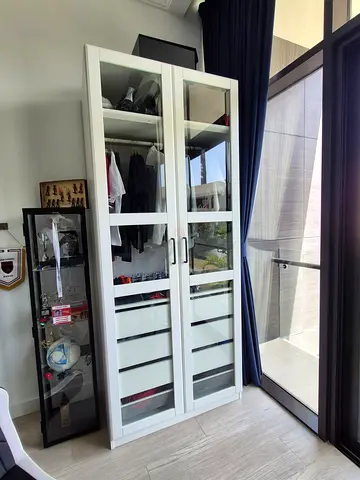 IKEA PAX Wardrobe featuring a hanging rail, a pull-out drawer with felt organizers, and a built-in s