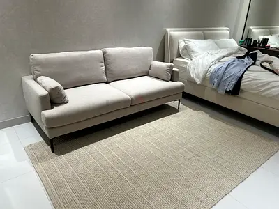 Light beige 2-seater fabric sofa in excellent condition