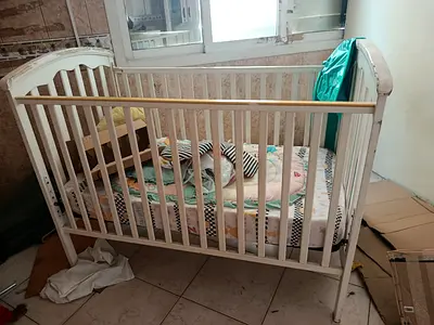 Used white wooden baby crib with mattress — good condition
