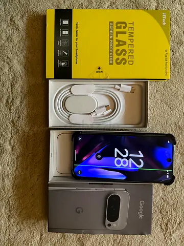 Google Pixel phone with original box, charger, and screen protector only in display line